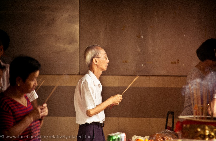 Old Man Praying In Tanglin Halt - AspirantSG