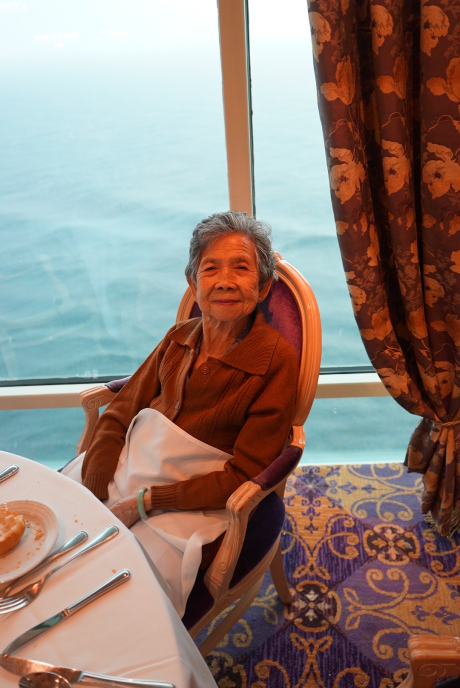 Grandmother looking please with meals on Royal Caribbean - AspirantSG
